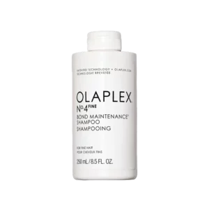 Witte fles Olaplex No.4 Fine Bond Maintenance Shampoo van 250 ml tegen een zwarte achtergrond.