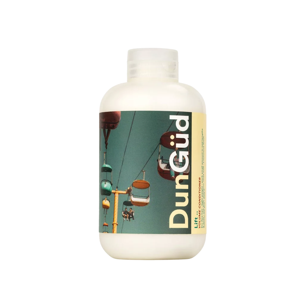 Fles DunGüd Lift Volumising Conditioner met kleurrijke stoeltjeslift-afbeelding op het etiket.