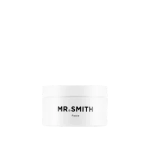Witte pot Mr. Smith Paste haarstylingproduct met zwart logo op de voorkant.