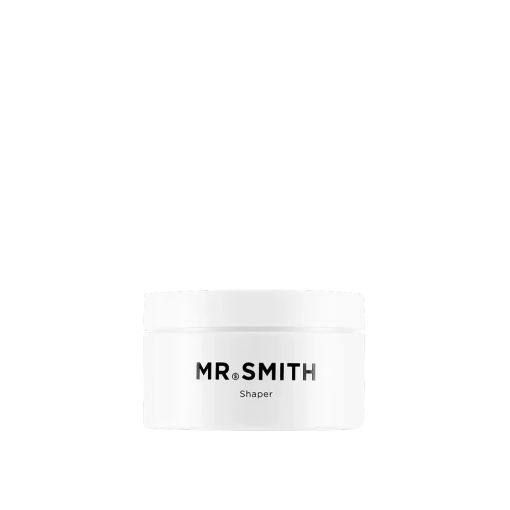 Witte pot Mr. Smith Shaper haarstylingproduct tegen een zwarte achtergrond.