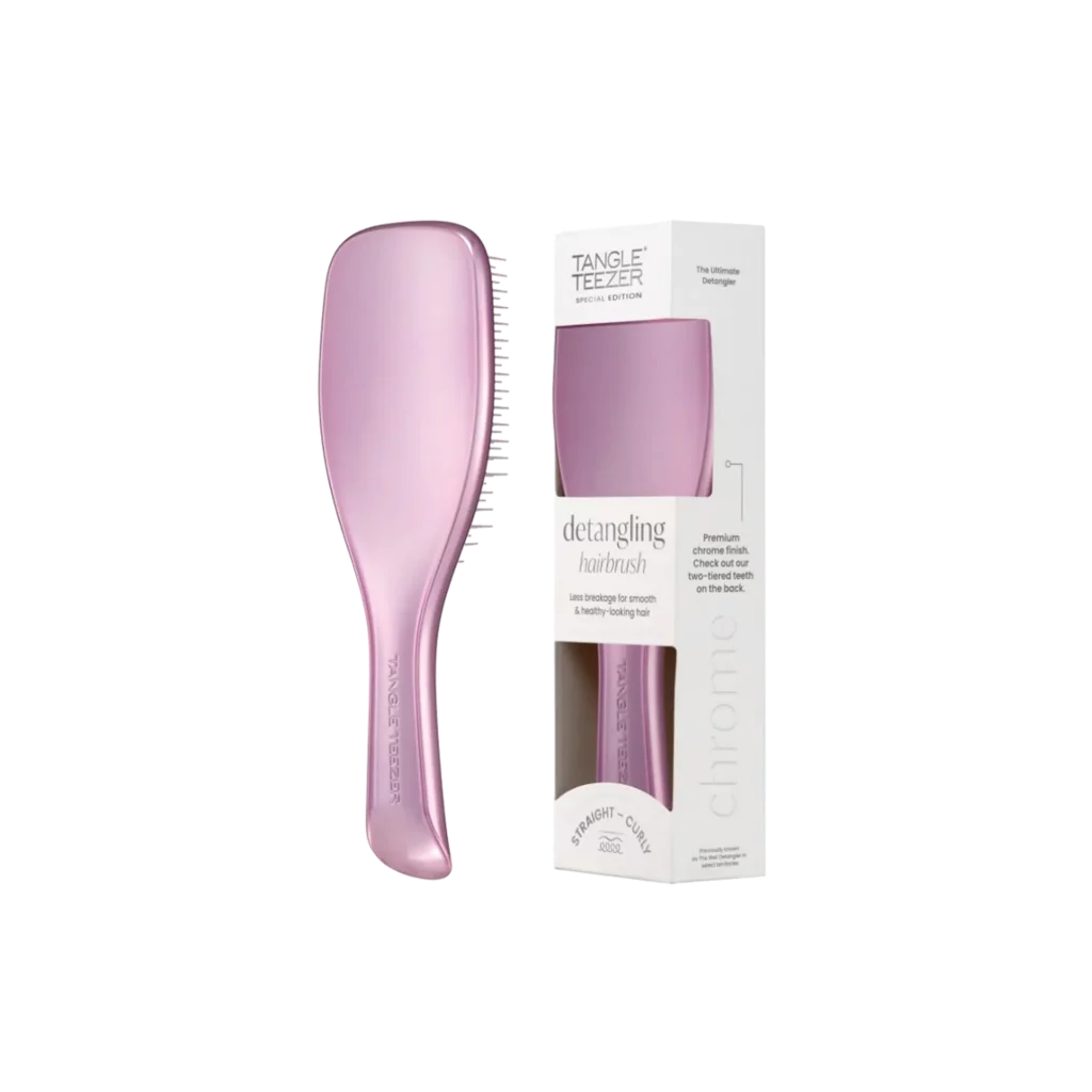 Lichtpaarse Tangle Teezer ontklittende haarborstel naast bijpassende verpakking in wit en transparant design.
