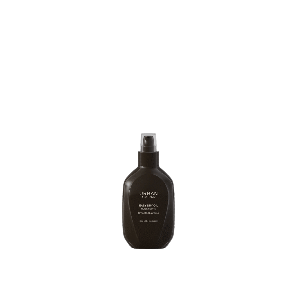 Zwarte flacon van Urban Alchemy Easy Dry Oil Smooth Supreme met pompdispenser.